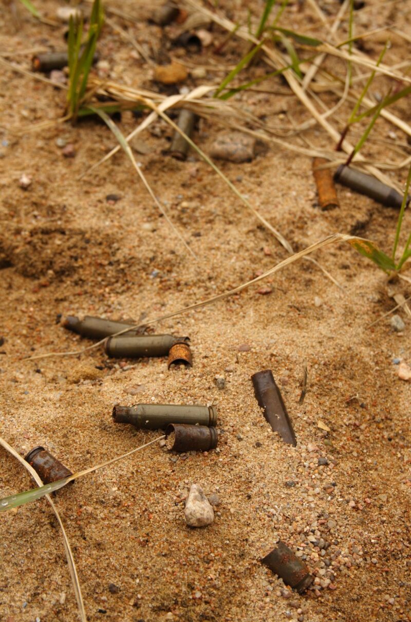 Empty ammo shell casing in the sand