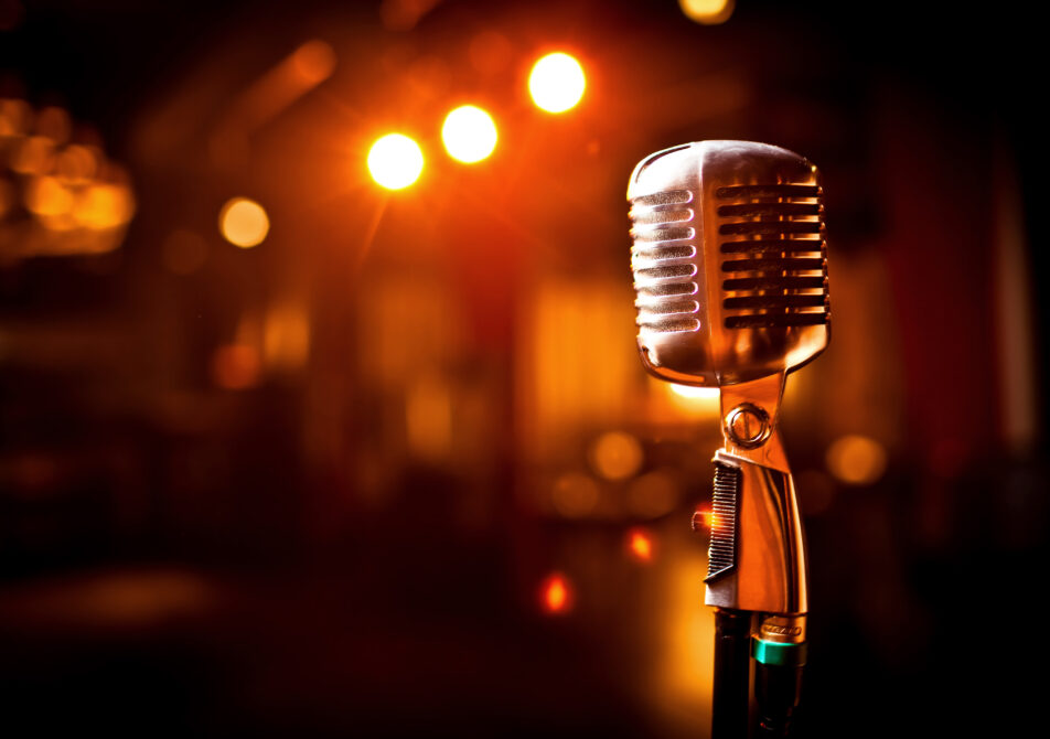 Retro microphone on stage in restaurant. Blurred background
