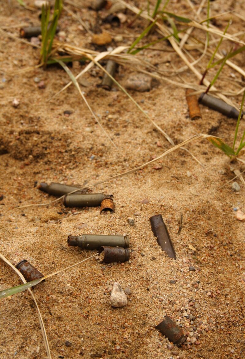 Empty ammo shell casing in the sand